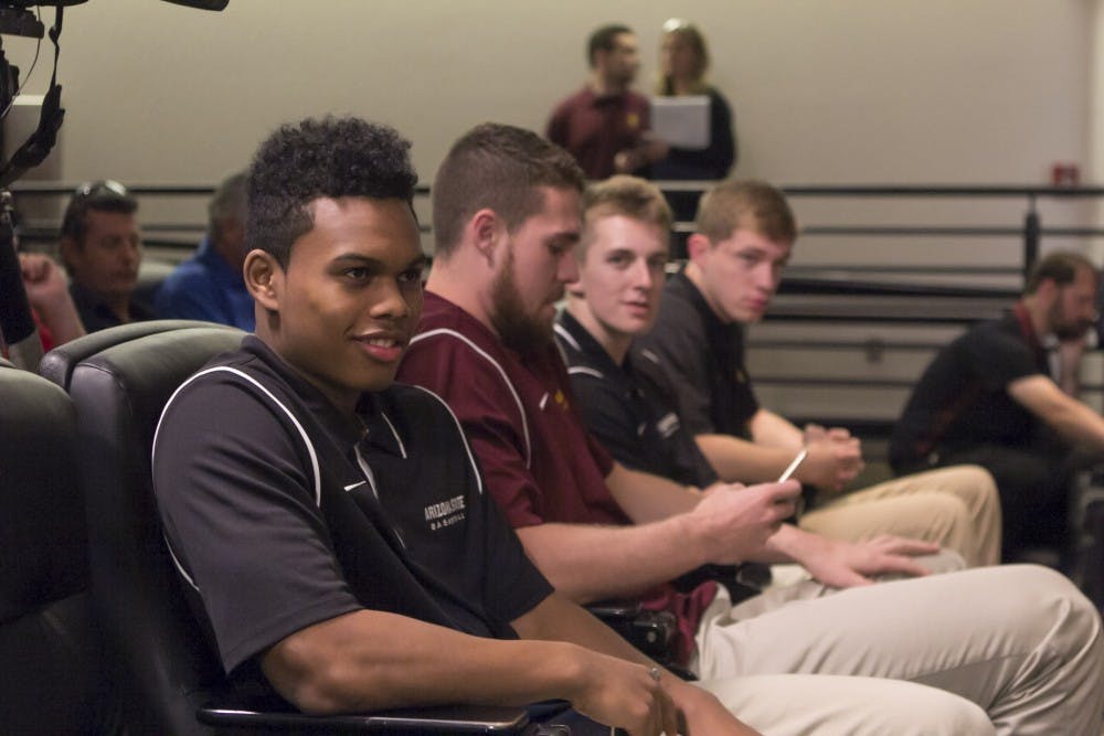 ASU freshman Tra Holder sits in the front row of a press conference to hear the announcement of Bobby Hurley as the men's basketball coach on April 10, 2015.