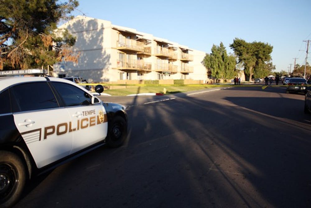 Two victims were shot inside of an apartment complex near East University and South McClintock Drives resulting in the death of one man. Tempe Police are searching for two suspects in their early 20’s. (Photo by Shawn Raymundo)