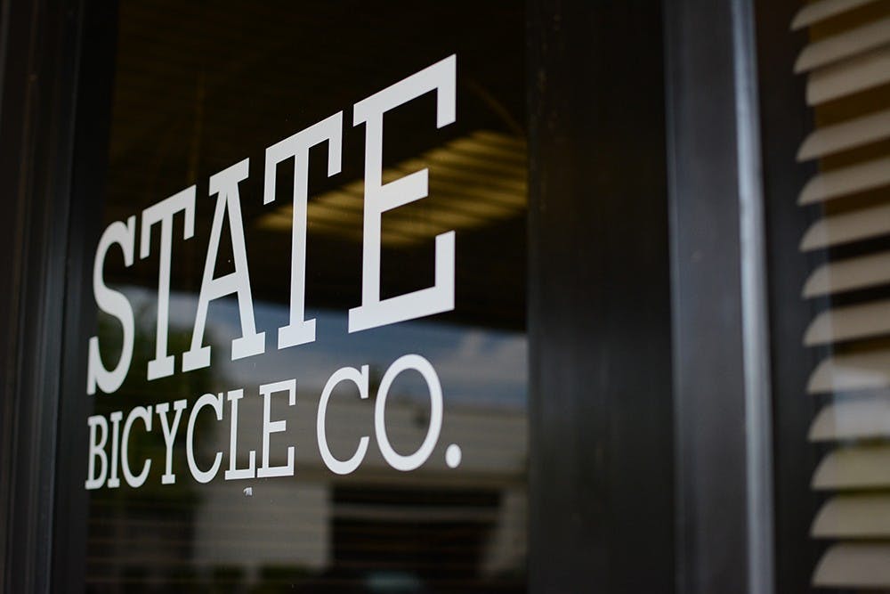 State Bicycle Co.'s label is emblazoned on the door to its main store.