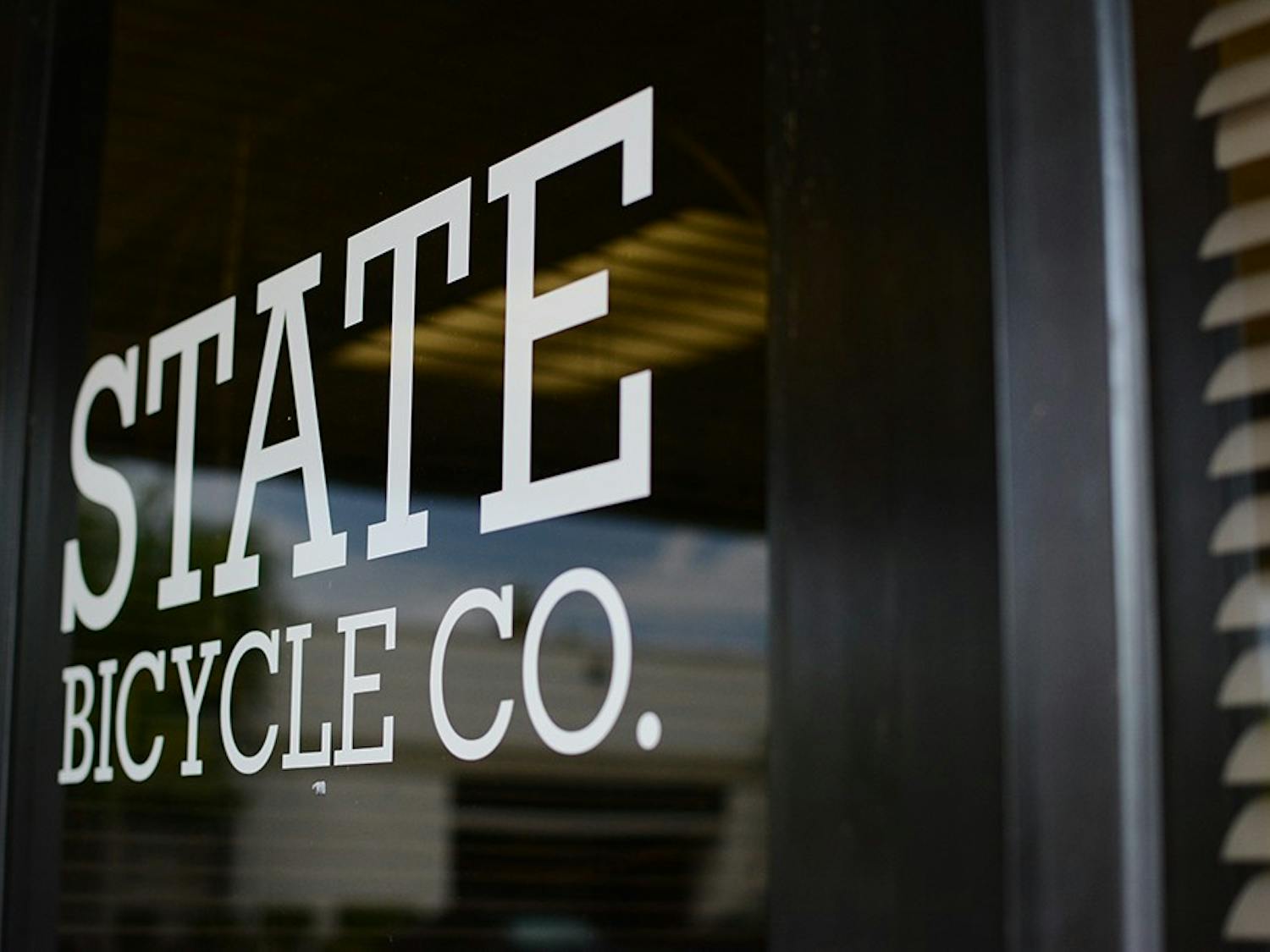State Bicycle Co.'s label is emblazoned on the door to its main store.