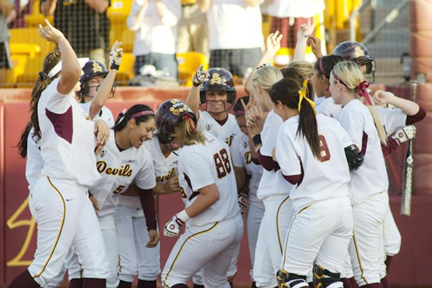 Groove is in the Heart: Junior Annie Lockwood celebrates with the rest of the Sun Devils after a home run against San Diego State on May 22. The team’s tendency to dance after home runs has become a common fixture throughout season. (Photo by Aaron Lavinsky)