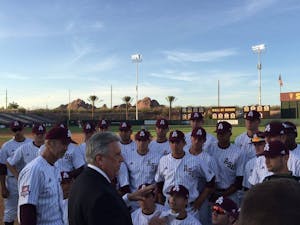 Rick Monday, in the suit, talks to the ASU baseball team prior to its game against&nbsp;Arizona on Tuesday, April 26, 2016 at Phoenix Municipal Stadium in Tempe, Arizona. The team was honoring Monday, an ASU alumnus, for the 40-year anniversary of him saving a flag that was being burnt in protest at Dodger Stadium.