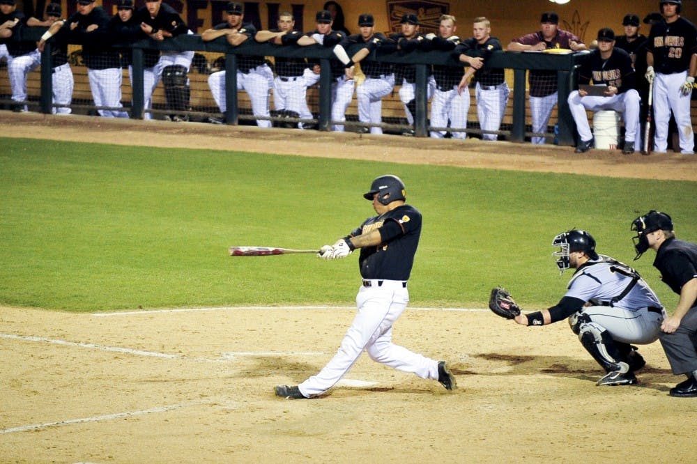 Junior catcher RJ Ybarra swings for a first base hit during the game against Purdue on Feb 27, 2015. The Sun Devils defeated Purdue 15-5 at Phoenix Municipal Stadium. (Andrew Ybanez/The State Press)