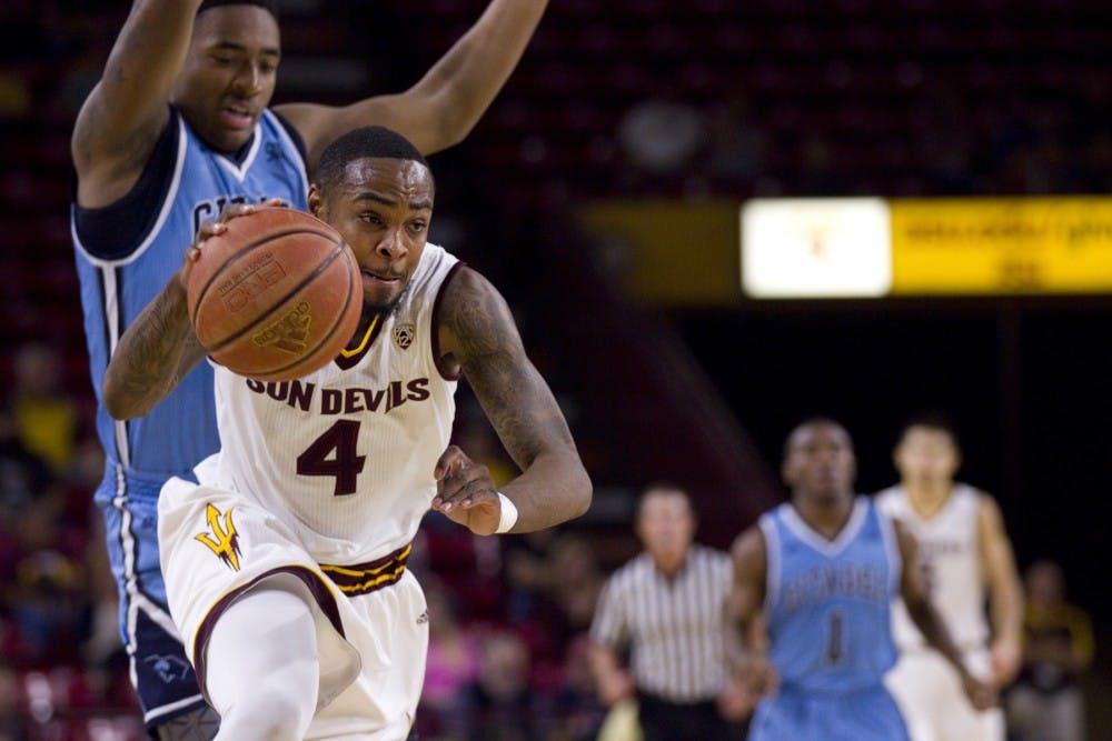 ASU senior guard Torian Graham (4) drives around a defender on his way to the basket in the first half of a game versus the Citadel Bulldogs in Wells Fargo Arena in Tempe, Arizona on Wednesday, Nov. 23, 2016.