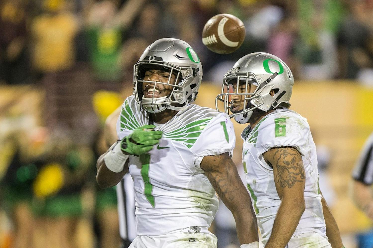 Oregon corner back Arrion Springs, left, celebrates with safety Charles Nelson, right, after pulling in an interception to end a game against ASU on Thursday, Oct. 29, 2015, at Sun Devil Stadium in Tempe, Ariz. The Ducks beat the Sun Devils 61-55 in the third overtime period. 