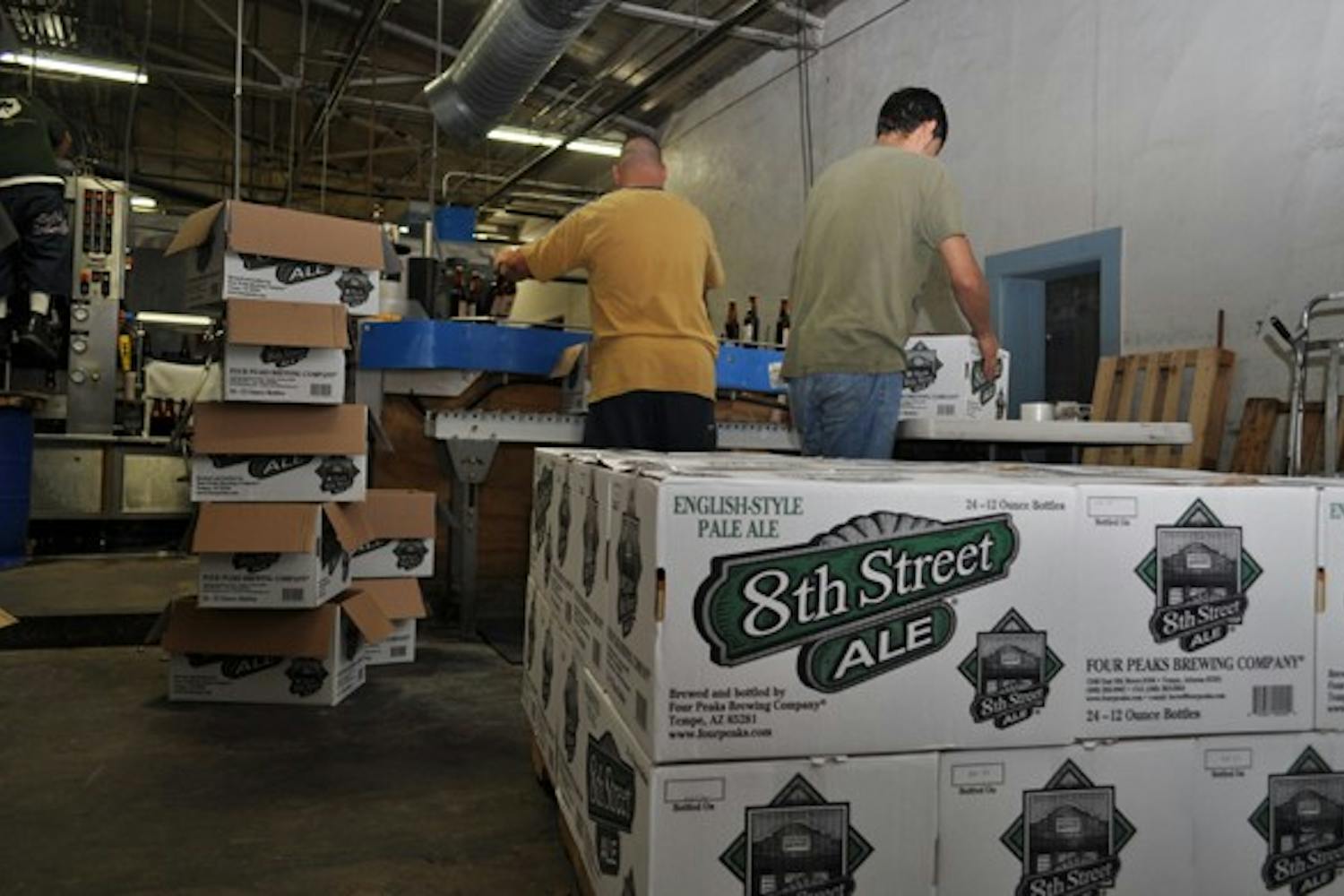 Workers pack up boxes of Ale at Four Peaks Brewery in Tempe. Photo by Alex Forestier.