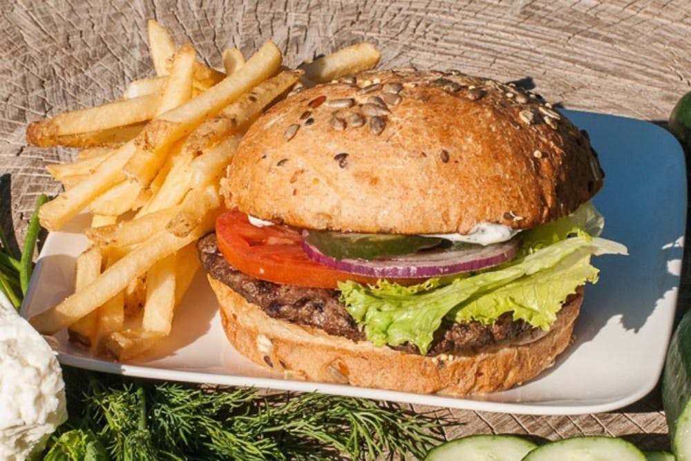 A hamburger and fries are pictured from Joe's Farm Grill.