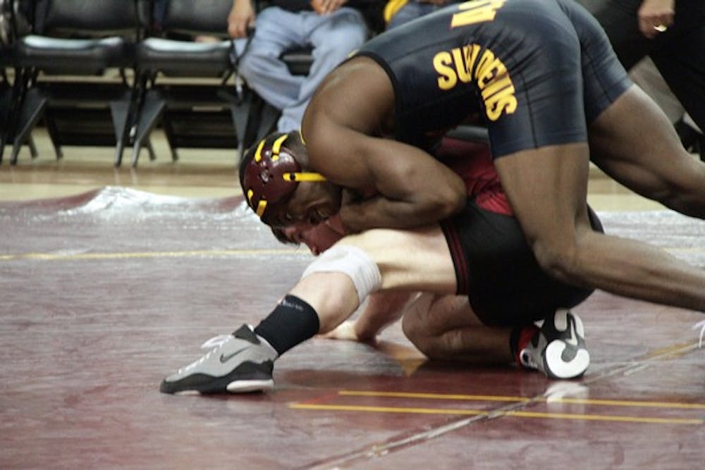 Redshirt freshman Kevin Radford pins an opponent in a Feb. 5 meet against Stanford. Radford has 16 wins this season and will be a key contributor in the Sun Devils’ return to prominence. (Photo courtesy of Jeremy Hawkes)
