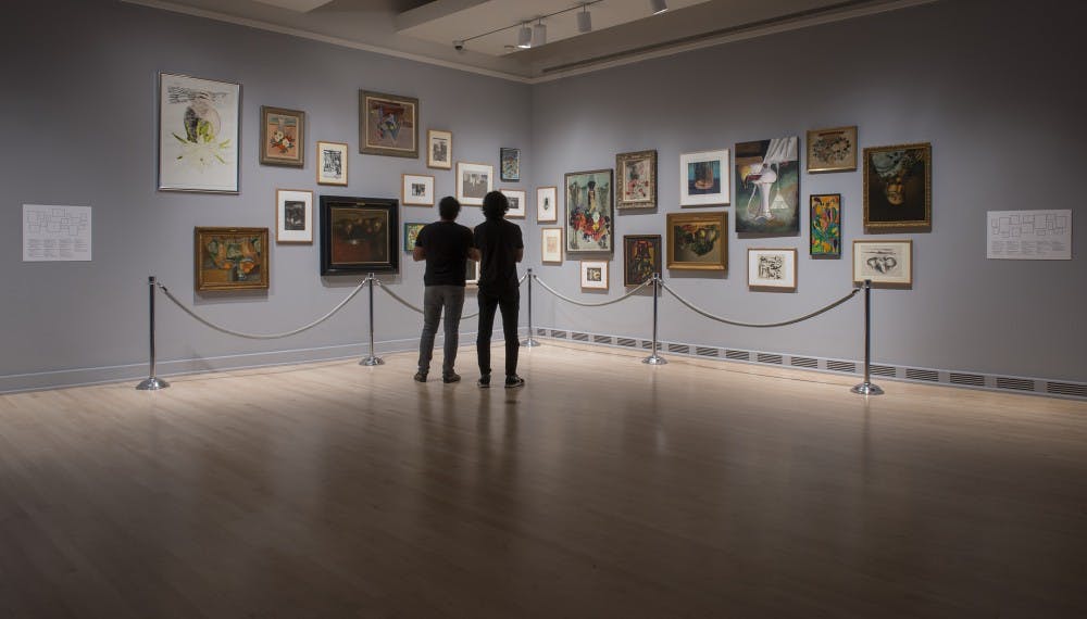 Viewers interact with&nbsp;Alejandro Almanza Pereda's still life works during&nbsp;"Encounter: Better to have loved and lost than never to have loved at all," an exhibition which runs until&nbsp;Nov. 26 at the ASU Art Museum.