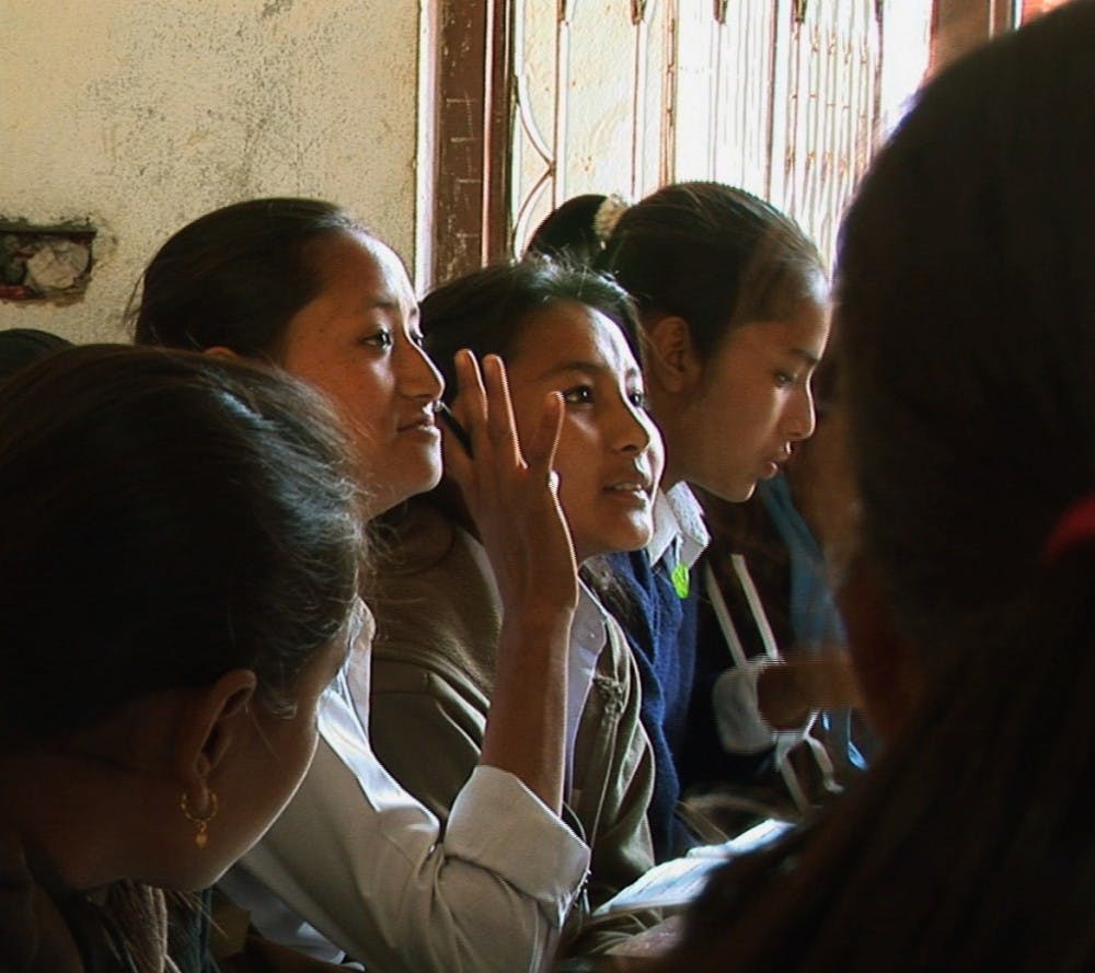 “If I were rich, I know I could become a scientist,” says Sanju, a thirteen-year-old from Nepal in To Educate A Girl. Photo courtesy of To Educate A Girl. 