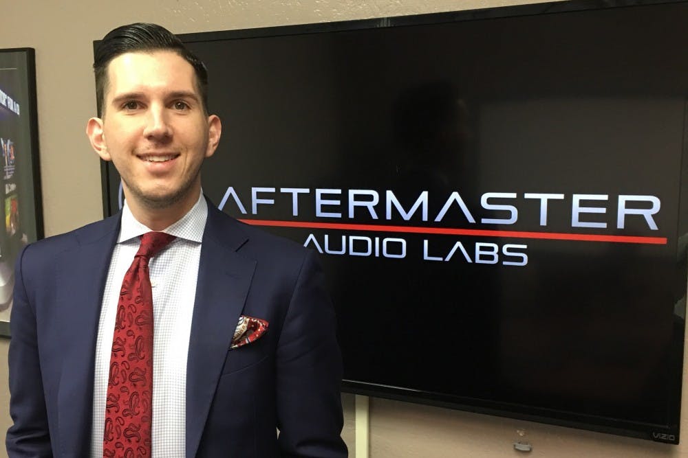 Business and communications alumnus Aaron Ryckman poses for a photo.