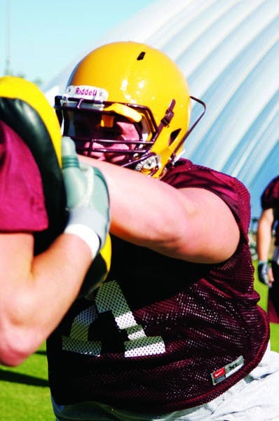 BIG HELP: ASU junior offensive lineman Brice Schwab participates in a drill during spring practice. Schwab, a junior college transfer, was ASU's highest-rated recruit of the 2010 class and is expected to start right away. (Photo by Scott Stuk)