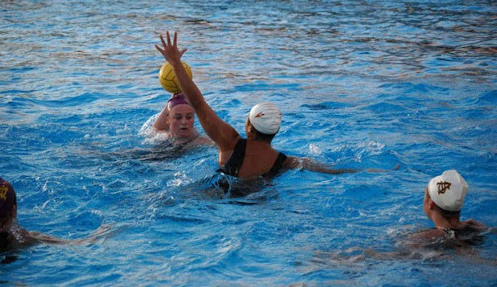 Freshman utility player Katie Sverchek winds her arm back ready to throw during an ASU water polo practice on Jan. 15. The team started off the season the right note going 6-0 in the UCSB tournament. (Photo by Murphy Bannerman)