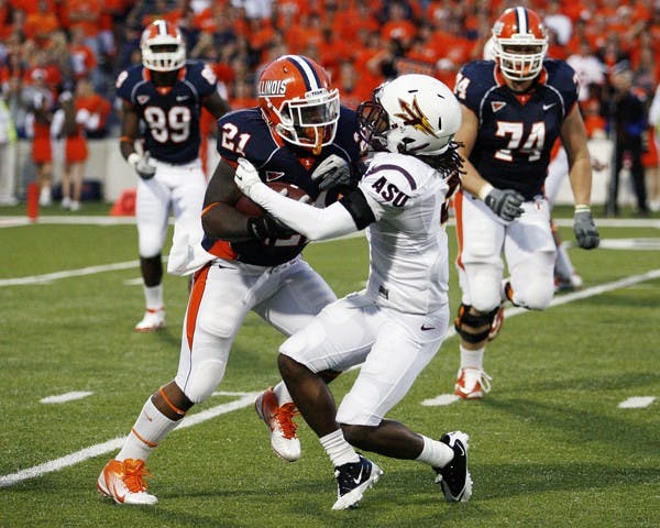 Daryl Quitalig The Daily IlliniIllinois' Jason Ford (21) is tackled by Arizona State's Eddie Elder (2) during the game at Memorial Stadium. The Illini won 17-14.