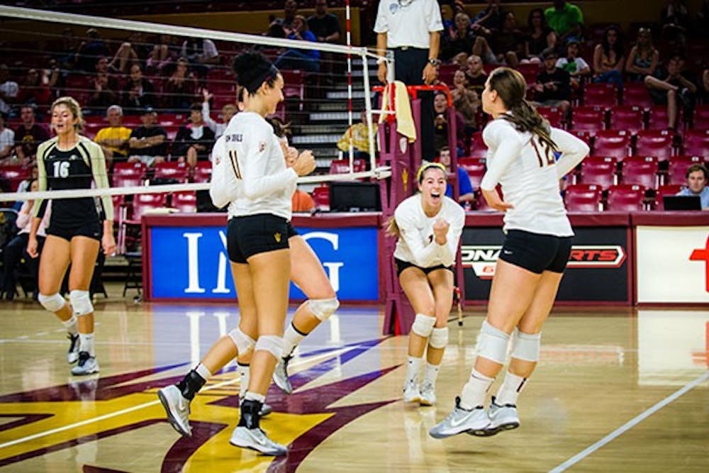 Sun Devil volleyball team celebrating a hard-fought point at the end of the 2nd set in their sweep against Colorado