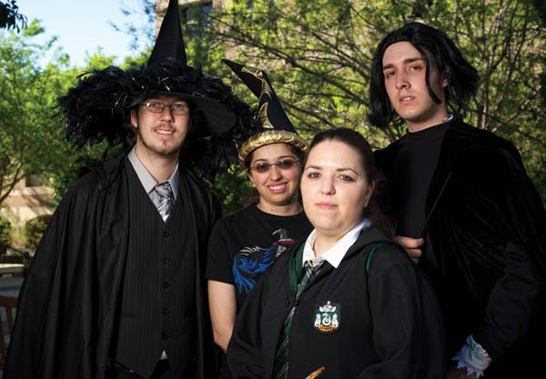 Amanda Perreault, center, as Pansy Parkinson, is joined by Andrew Hood as Professor Snape and two others students for Harry Potter Day in 2011 on the West campus. (Photo by Michael Arellano)
