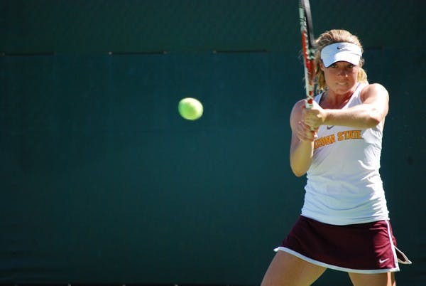 Senior Hannah James strikes the ball during a match against St. Mary's on March 3. (Photo by Murphy Bannerman)