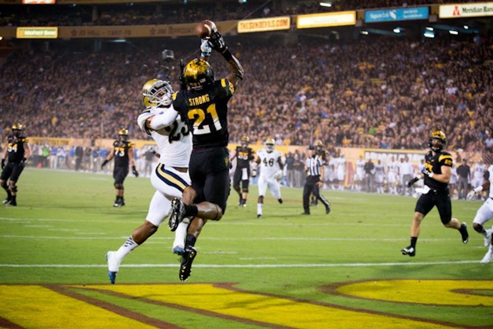 Redshirt junior wide receiver Jaelen Strong attempts to retrieve a pass from redshirt sophomore quarterback Mike Bercovici. The Sun Devils lost to UCLA on Sept 25 at Sun Devil Stadium with a score of 62-27.