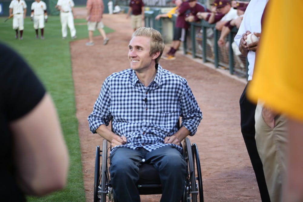 ASU graduate and the game's honoree Cory Hahn talks among reporters and officials on Friday, March 3, 2016, at Phoenix Municipal Stadium during the gamea gainst Eastern Michigan University.