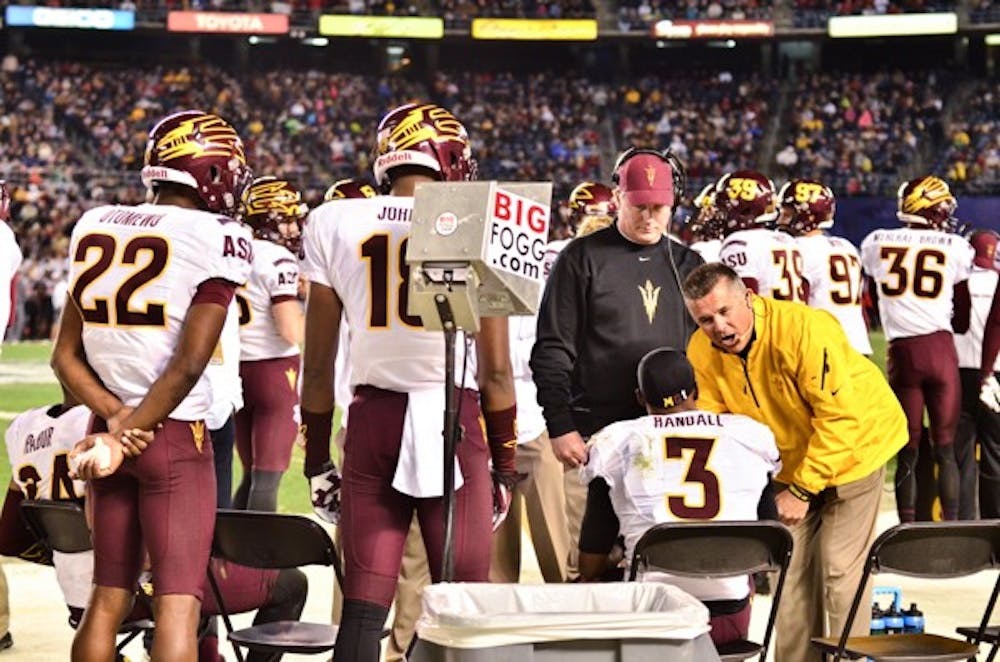ASU football coach Todd Graham directs his players on the sidelines at the National University Holiday Bowl on Dec. 30. They lost 37-23 and finished the season 10-4. (Photo by Andrew Ybanez)