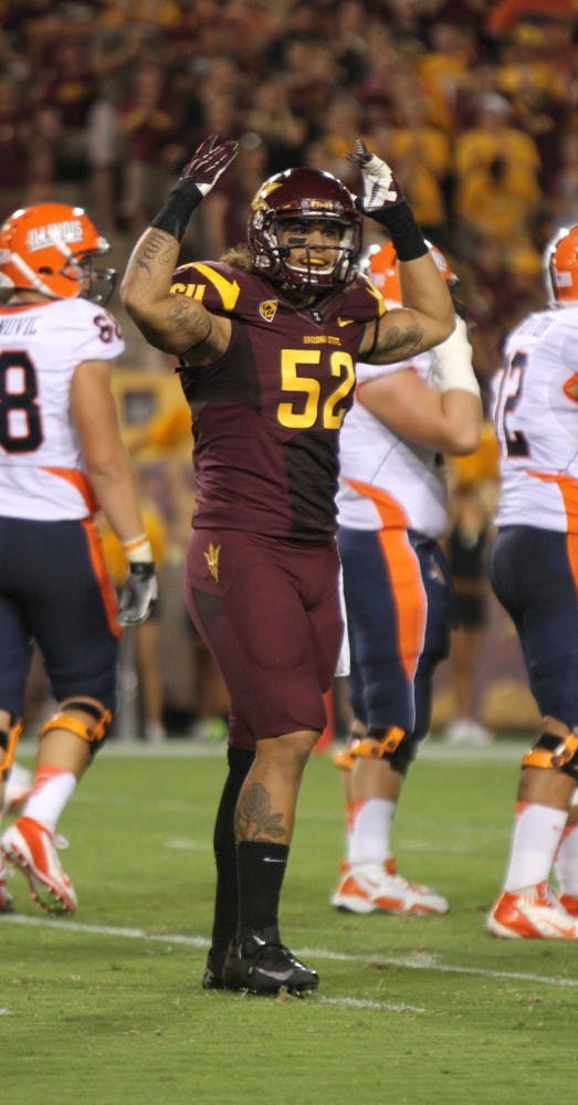 Redshirt junior defensive end Carl Bradford celebrates at a home game in Tempe. Coach Griswold, the head coach for sports performance on the team, believes that if he is more accessible to players on the team off the field, they will do better on the field. 