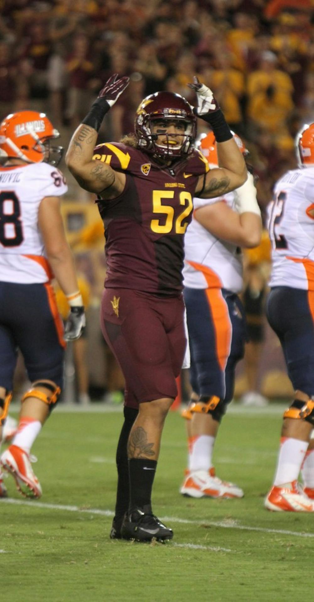 Redshirt junior defensive end Carl Bradford celebrates at a home game in Tempe. Coach Griswold, the head coach for sports performance on the team, believes that if he is more accessible to players on the team off the field, they will do better on the field. 