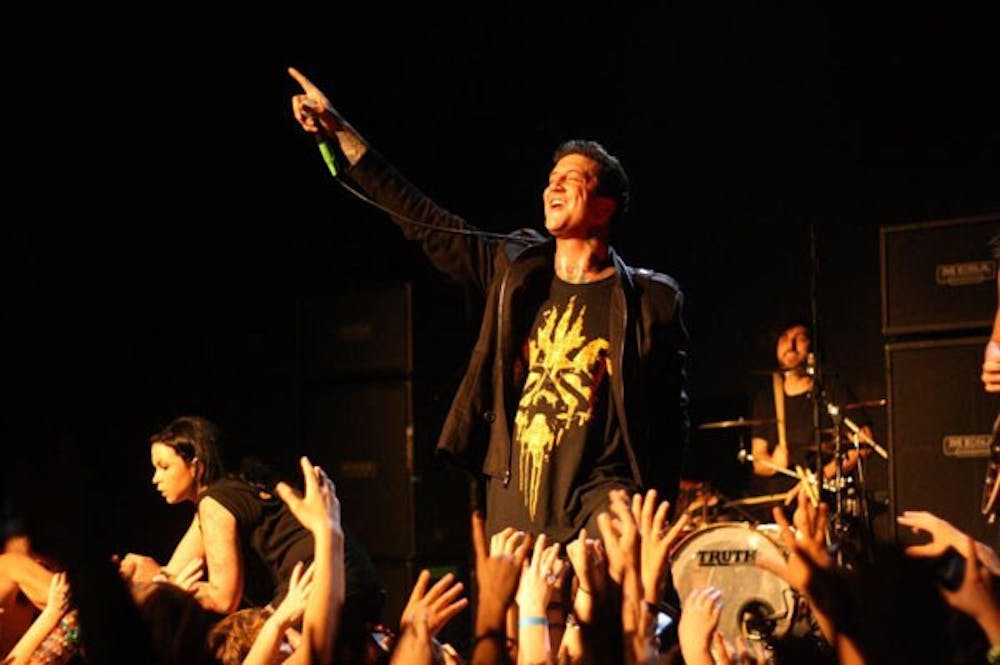 Mice and Men frontman, Austin Carlile, reaches the mic out to the crowd during their performance at The Nile Theater, Sunday evening. (Photo Courtesy of KJ Mark)