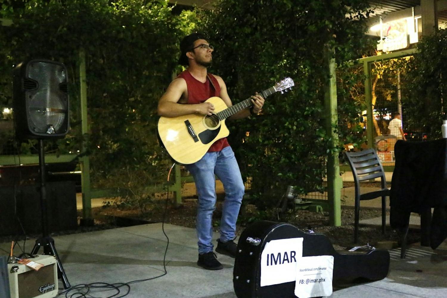ASU communications junior Andres “Imar” Rosales performs covers of Pumped Up Kicks and Sweater Weather at The Heart of an Artist open mic night at the downtown campus on Tuesday, March 21, 2017.