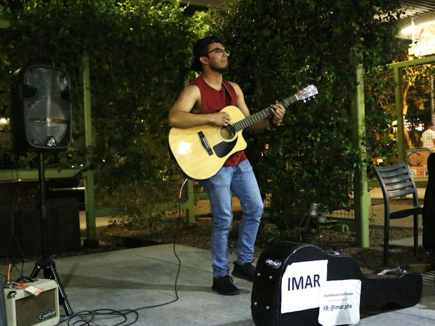 ASU communications junior Andres “Imar” Rosales performs covers of Pumped Up Kicks and Sweater Weather at The Heart of an Artist open mic night at the downtown campus on Tuesday, March 21, 2017.