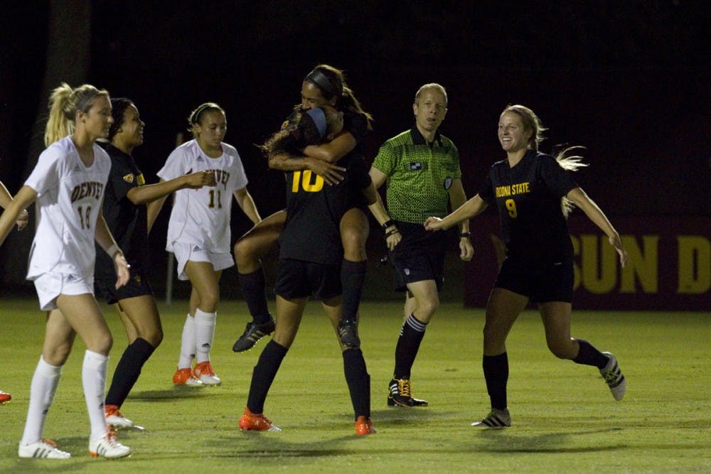 ASU junior forward Jazmarie Mader holds up redshirt senior midfielder Lucy Lara after scoring the Sun Devils’ lone goal in a 3-1 loss to Denver University in Sun Devil Soccer Stadium in Tempe, Arizona on Sunday, Sept. 4, 2016.