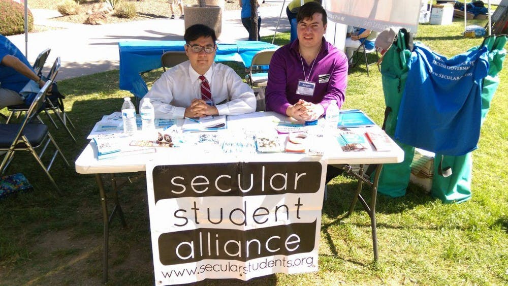 Tann Cheevasittirungruang, left, and Angel Garcia, right, sit at their table at Secular Day at the Arizona State Capitol on&nbsp;March 21, 2017.&nbsp;
