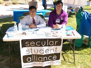 Tann Cheevasittirungruang, left, and Angel Garcia, right, sit at their table at Secular Day at the Arizona State Capitol on&nbsp;March 21, 2017.&nbsp;