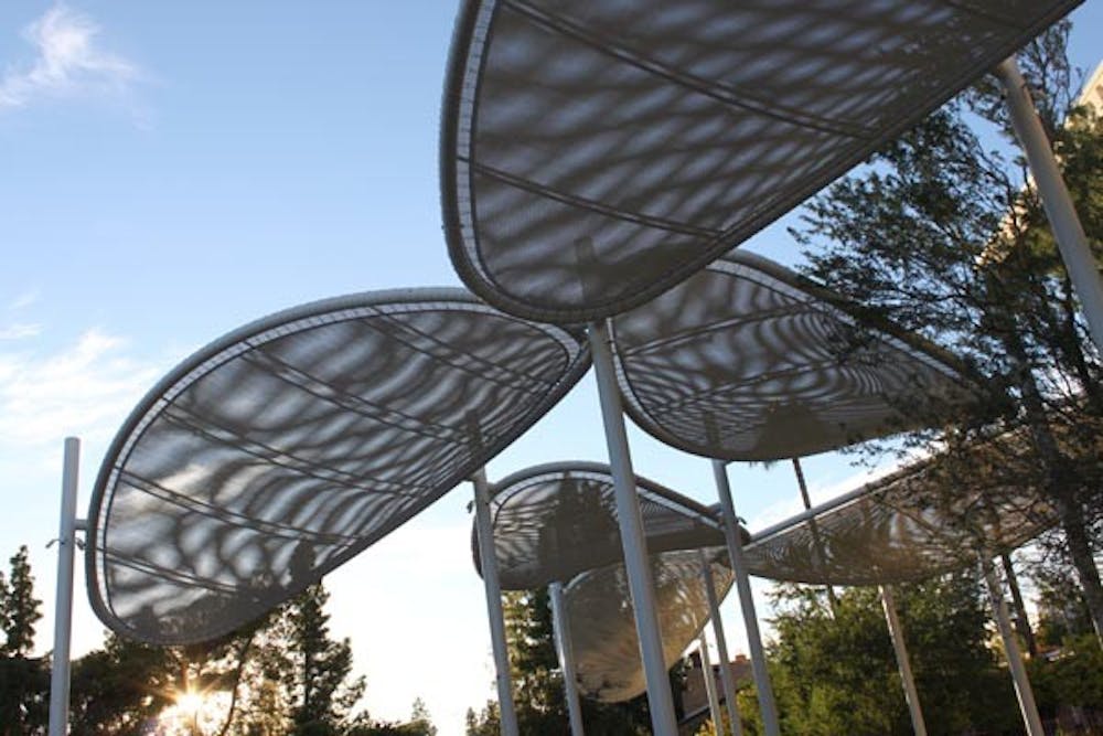 BREAKING THROUGH: The sunlight breaks through the lighted shade canopies outside the Memorial Union. The shade canopies were installed during the summer of 2008. (Photo by Rosie Gochnour)