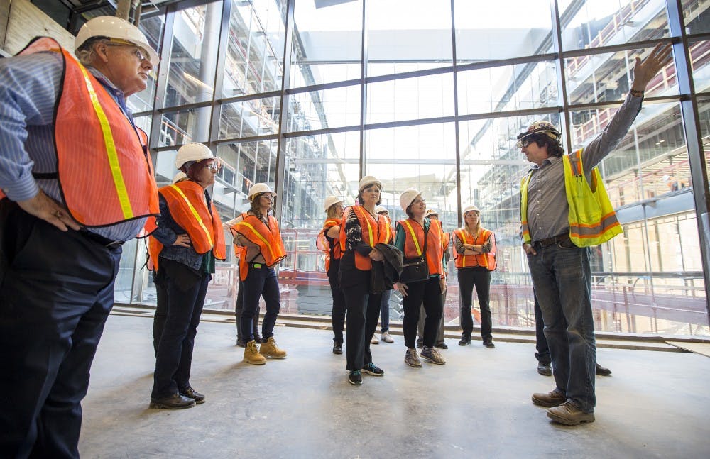 Project Manager Lew Laws, of DPR Construction, gives a tour of the Arizona Center for Law and Society to a group of faculty, alumni and reporters on the ASU Downtown Campus in Phoenix, Arizona, on Wednesday, March 23, 2016. The construction project is set to be finished and turned over to ASU in early June, Laws said. 