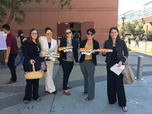 Some voters handed out nonpartisan cupcakes to encourage ASU students to express their right to vote outside of the Sun Devil Fitness Complex on Election Day 2016.