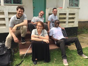 ASU HEAL leadership poses for a photo on the doorstep of the HEAL Tanzania Headquarters.