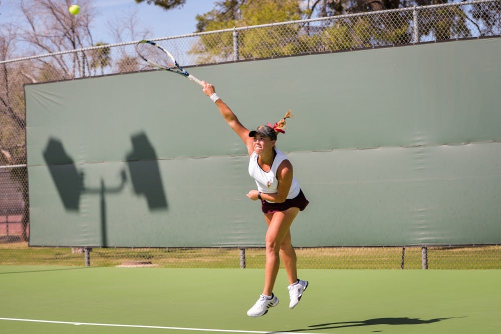 Junior Kassidy Jump serves the ball during a doubles matchup against the California Bears on Friday, March 4, 2016 at the Whiteman Tennis Center in Tempe, Ariz.
