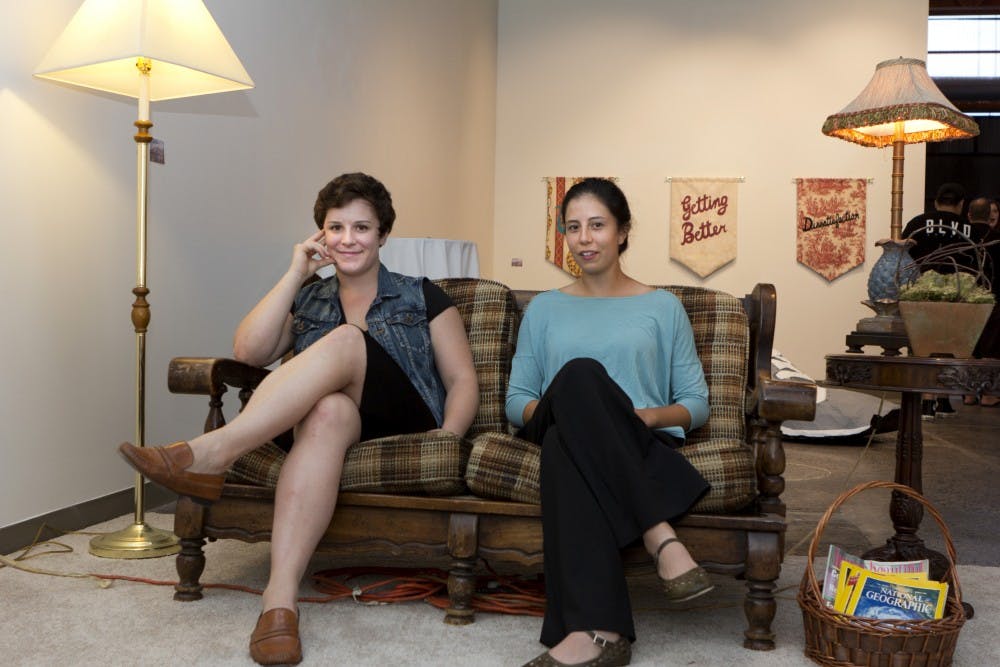 Ximenna Hofsetz (left) and Tiernan Warner (right) on September 16 at the opening of their gallery "Why we Bend" at the Step Gallery.? (Photo by Emily Johnson)