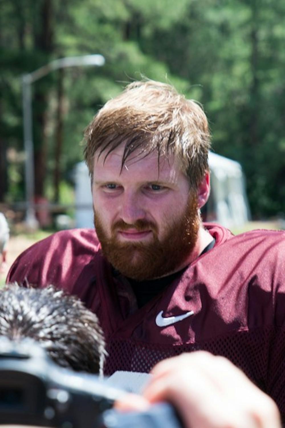 Redshirt senior offensive lineman Chip Sarafin speaks to reporters after a practice at Camp Tontozona Aug 14. Sarafin made national headlines on Aug 13 after becoming the first active openly gay player in Division I college football. (Photo by Andrew Ybanez)