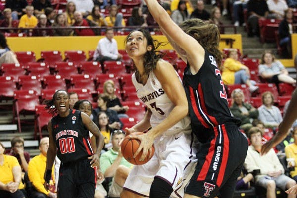 Junior forward/center Joy Burke looks for a shooting angle around a Texas Tech defender during the Sun Devils’ 61-49 loss to the Lady Raiders last Sunday. (Photo by Kyle Newman)
