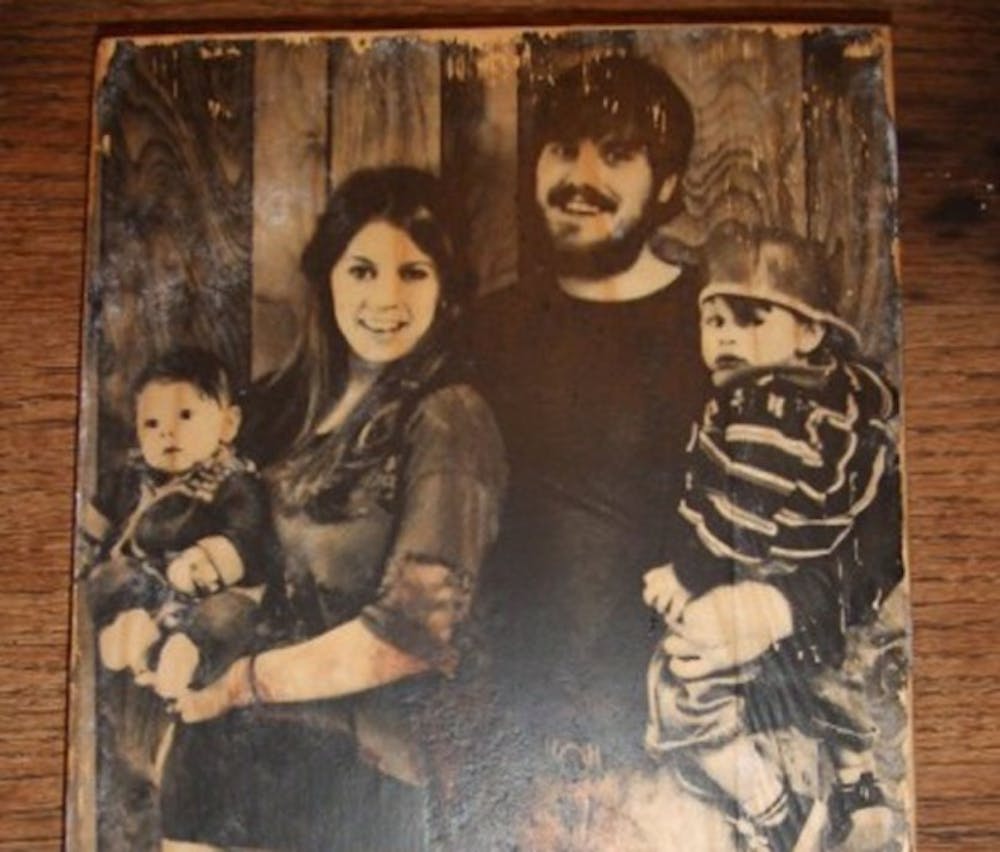 A photo transferred onto wood. Photo from youtube.com/user/crystalshea.