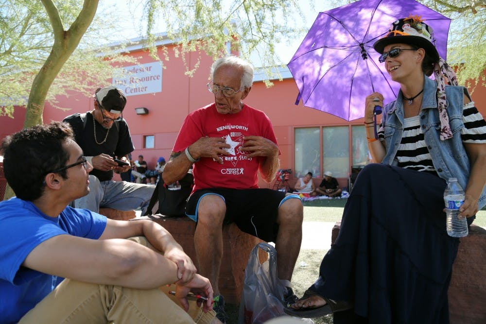 A humans of SHOW volunteer speaks with people from&nbsp;the Human Services Campus about homelessness on Feb. 3, 2017.&nbsp;