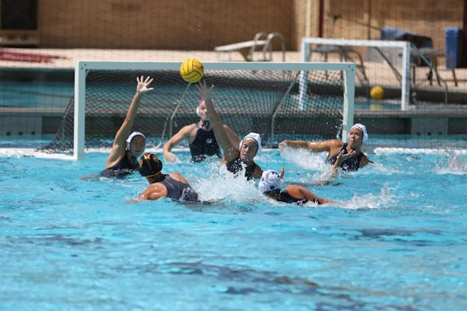 A California player blocks a shot by freshman attacker Izabella Chiappani at a home game on April 12. (Photo by Arianna Grainey)