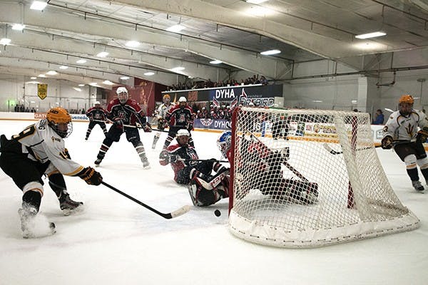 UA goalie Dylan Hojnacki, narrowly blocks ASU forward Chriss Blessing’s shot, assist from forward Sean Murphy at a home game against UA on Saturday, Oct. 11, 2014 in Tempe. UA was shutdown by ASU 3-0. (Photo by Mario Mendez)