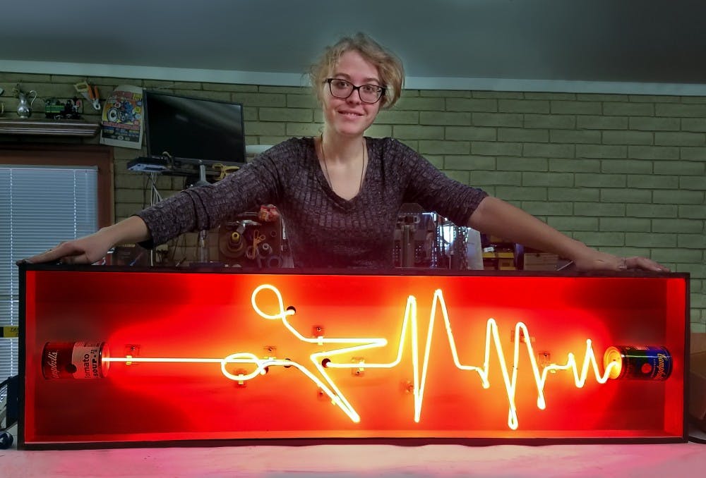 ASU psychology student&nbsp;Makita White poses with her piece titled "Can You Hear Me" in her workspace in Tempe, Arizona.