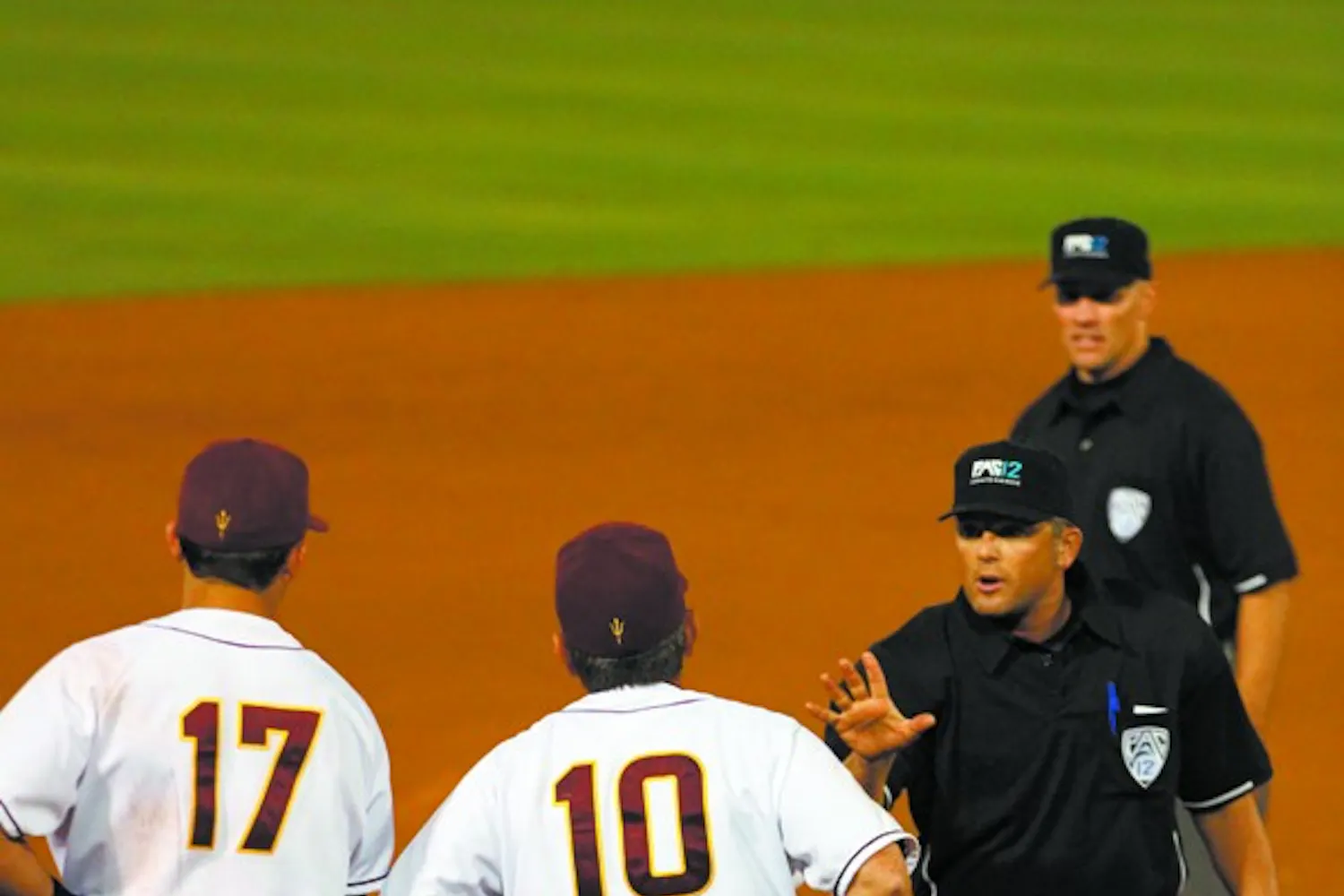 HOME FREE: Senior Raoul Torrez slides across the plate as the game-winning run in ASU’s 3-2 win on Sunday. (Photo courtesy of Andrew Pentis)