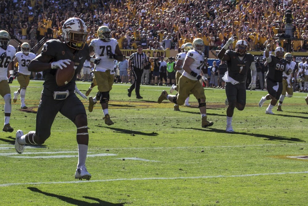 Redshirt senior defensive back Damarious Randall runs an interception back for a touchdown in a home game against Notre Dame on Saturday, Nov. 8, 2014. ASU won against Notre Dame 55-31. (Photo by Alexis Macklin)