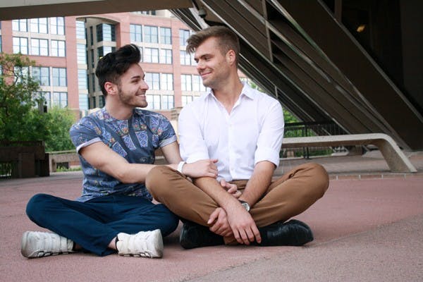 Juniors Alexander Mach (right) and Michael Howard sit outside of the Tempe City Hall Building. The City of Tempe has expressed interest in legalizing civil unions, and although Mach and Howard’s relationship is fairly new, they say they are excited by the city’s progressive attitude toward gay rights. (Photo by Hector Salas Almeida)