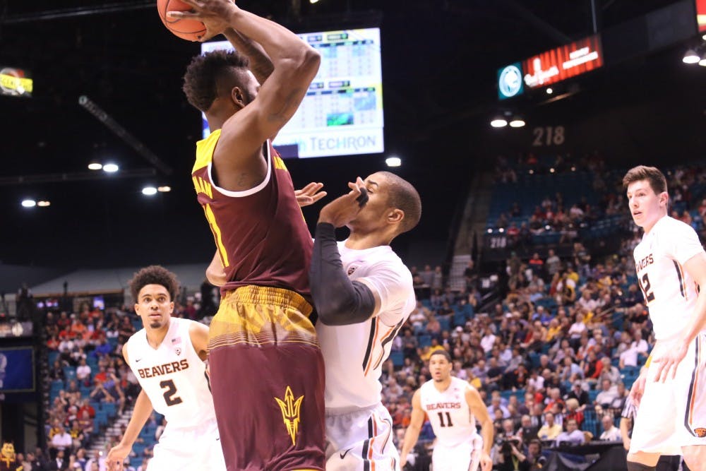 Junior forward Savon Goodman backs down OSU's Gary Payton during the first round of the Pac-12 Tournament on Wednesday, March 9, 2016, at MGM Grand Garden Arena&nbsp;in Las Vegas, Nevada. ASU men's basketball lost&nbsp;75-66.
