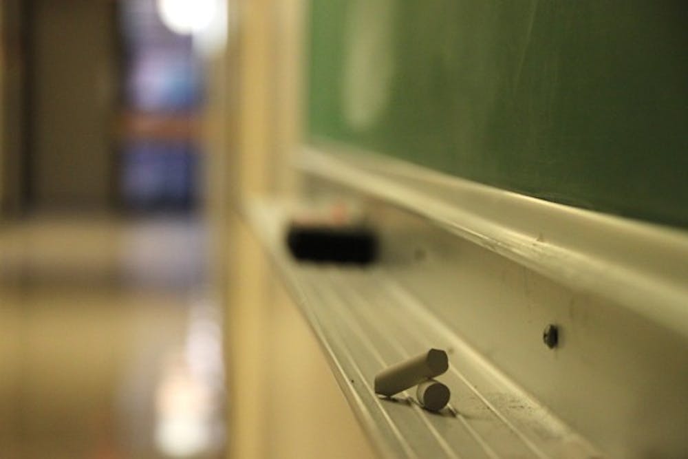 CHALK LINES: Chalkboards line the hallways in the physical sciences building on the Tempe campus Monday afternoon. (Photo by Rosie Gochnour)